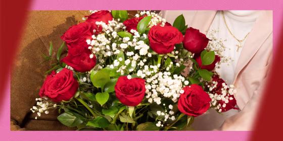 Image of people holding roses