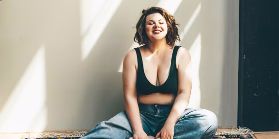 Beautiful plus size woman relaxing in underwear.
