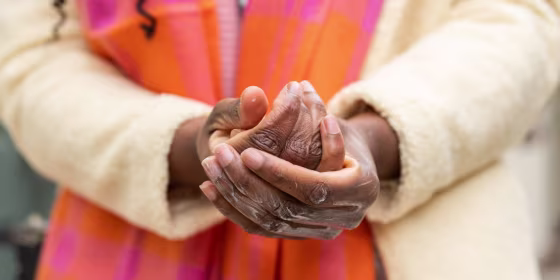 Woman rubbing lotion on her hands