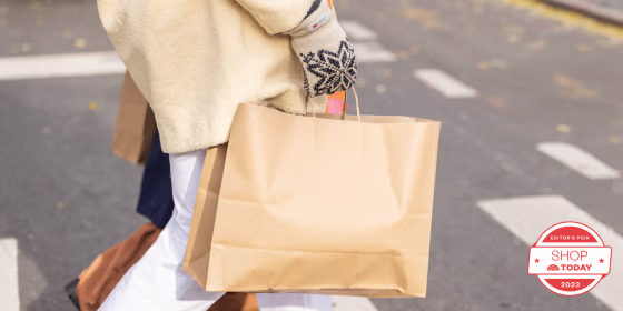Woman holding shopping bag outside