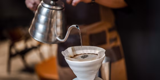 Close up of hand brewing coffee