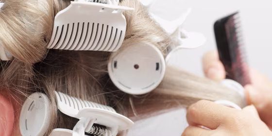 Hairdresser putting in curlers