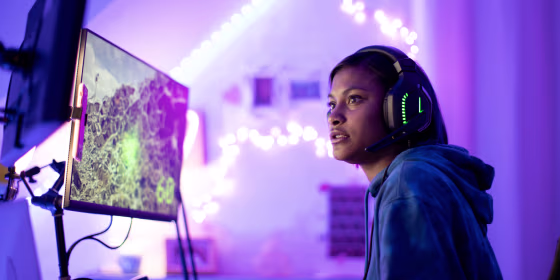 Woman looking at a gaming monitor