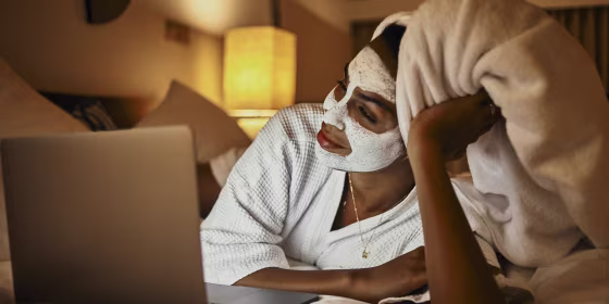 woman relaxing at home using laptop