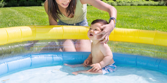 Little Baby sitting in a kiddie pool