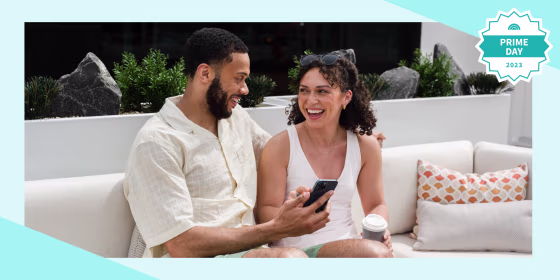 Couple sitting onside on their phone