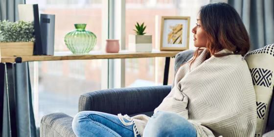 Woman sitting on her couch