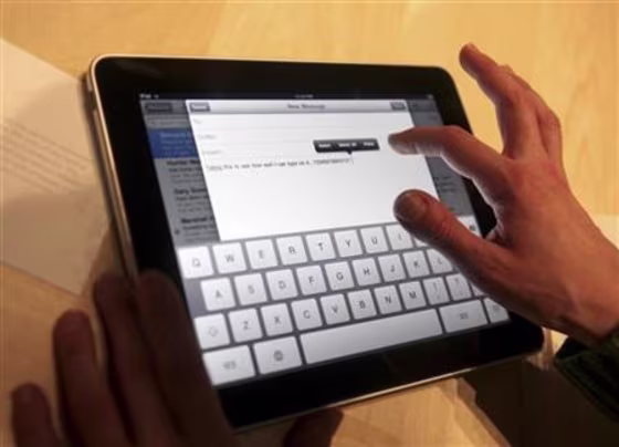 Typing is demonstrated on the new Apple  \"iPad\" during  the launch of the tablet computing device in San Francisco