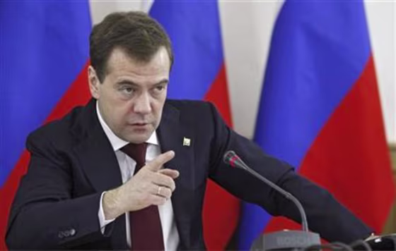 Russian President Dmitry Medvedev gestures during his meeting with the municipal education heads in Moscow
