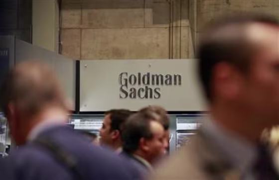 Traders work on the floor of the New York Stock Exchange near the Goldman Sachs stall