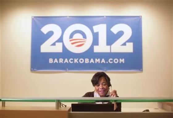 Volunteer receptionist answers the phone at President Obama's new campaign headquarters in Chicago