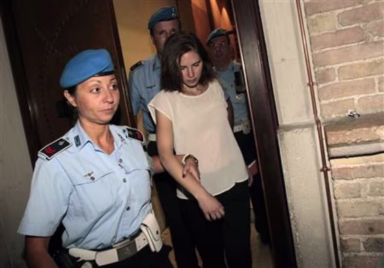 Knox, the U.S. student convicted of killing her British flatmate in Italy three years ago, arrives escorted by police in court in Perugia