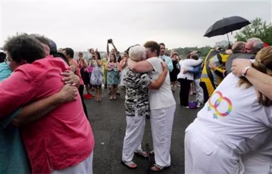 Forty six couples are wed in a large same-sex ceremony, near the brink of Niagara Falls, in Niagara Falls