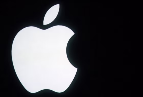 The Apple logo is displayed onstage before a product unveiling event at Apple headquarters in Cupertino
