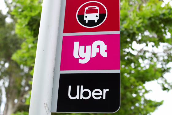 A sign marks a rendezvous location for Lyft and Uber users at San Diego State University in San Diego