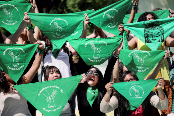 FILE PHOTO: Women hold green handkerchiefs during a protest in support of legal and safe abortion in Mexico City