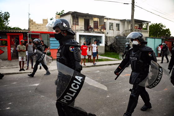 Riot police walk the streets after an antigovernmental demonstration in Havana on July 12, 2021.