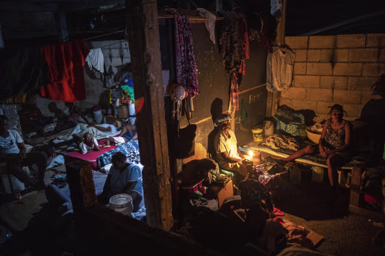 People displaced by gang violence occupy a school turned into a long-term shelter in Port-au-Prince, Haiti, on Sept. 16, 2021.
