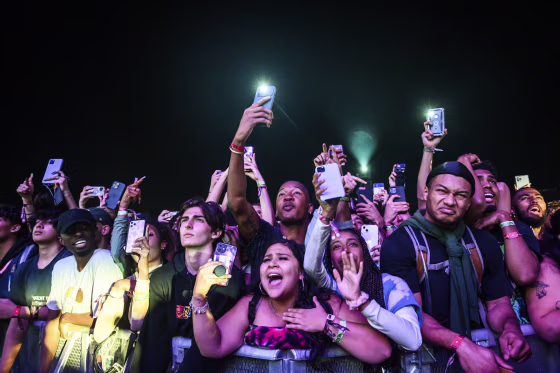 The crowd watches as Travis Scott performs at Astroworld Festival at NRG park on Nov.  5, 2021 in Houston.