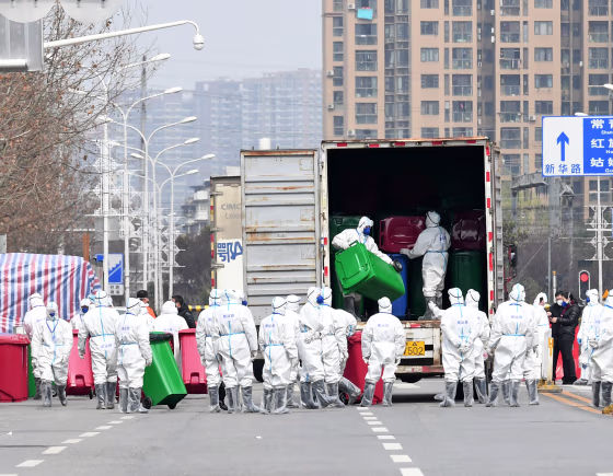 Workers in protective suits take part in the disinfection of Huanan seafood market, where the novel coronavirus is believed to have first surfaced, in Wuhan
