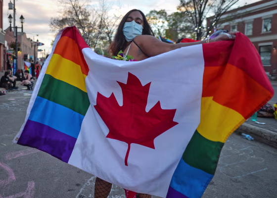Supporters of LGBTQ rights gather at Pride Corner in Edmonton, Canada, on Sept. 24, 2021, to counter protesting street preachers.