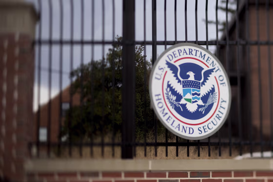 The U.S. Department of Homeland Security seal hangs on a fence at the agency's headquarters in Washington, on Dec. 11, 2014.