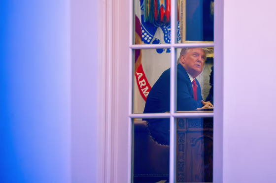 Image: President Donald Trump sits at his desk in the Oval Office of the White House on Nov. 13, 2020.