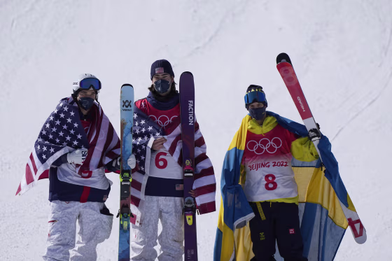From left, Nick Goepper, Alexander Hall and Jesper Tjader celebrate after the men's slopestyle finals at the 2022 Beijing Olympics on Wednesday, Feb. 16, 2022.