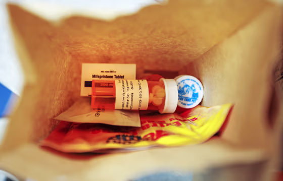 A paper bag containing the medication used for a medical abortion