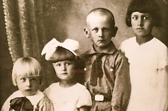 Dennis Wypijewski, left, with his siblings before he was deported as a child from Ukraine to Russia.