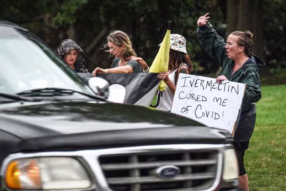 Protesters gather across the street from the Hamilton County Public Health building in Cincinnati's Corryville neighborhood on Aug. 9, 2021.