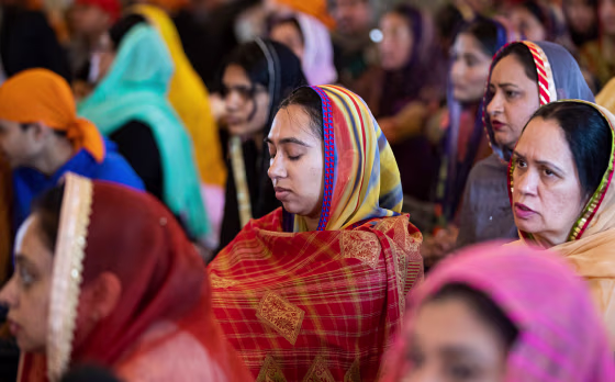 Image: A prayer service at the Sikh Satsang of Indianapolis on April 10, 2022 to remember the eight people killed at a FedEx facility on April 15, 2021.