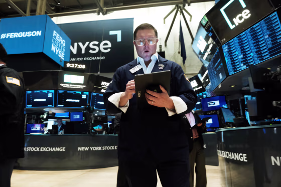 A traders works on the floor of the New York Stock Exchange