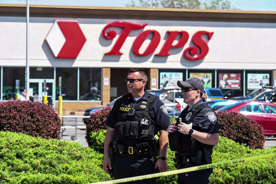 Police stand in front of a Tops grocery store in Buffalo, N.Y., on May 15, 2022.
