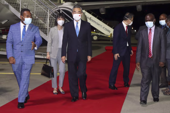 Chinese Foreign Minister Wang Yi, center, arriving in Honiara, Solomon Islands, on Thursday at the start of an eight-nation Pacific tour.