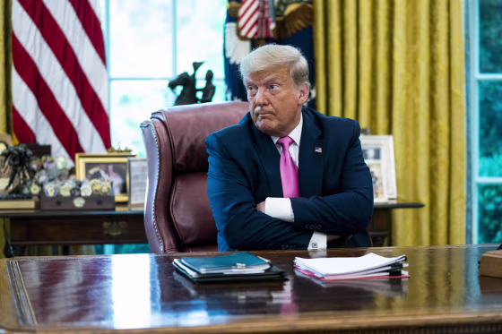 Image: Former President Donald Trump talks to reporters while hosting Republican Congressional leaders and members of his cabinet at the Oval Office on July 20, 2020.