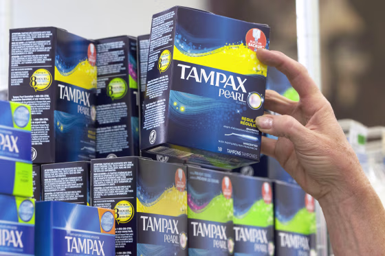 A store employee restocks tampons at Compton's Market, in Sacramento, Calif., on June 22, 2016.