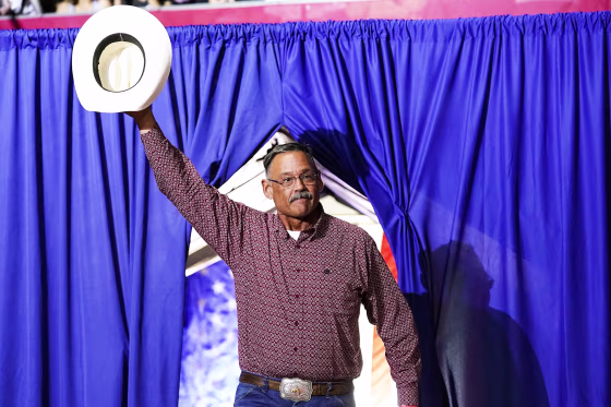 Mark Finchem, a Republican candidate for Arizona Secretary of State, waves to the crowd at a rally on July 22, 2022, in Prescott.
