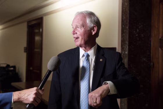 Sen. Ron Johnson speaks to a reporter outside of the Senate Homeland Security hearing room on Aug. 3, 2022.