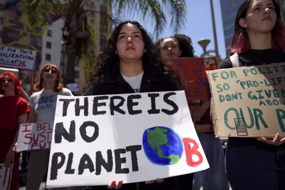 A protester is seen during a climate change demonstration