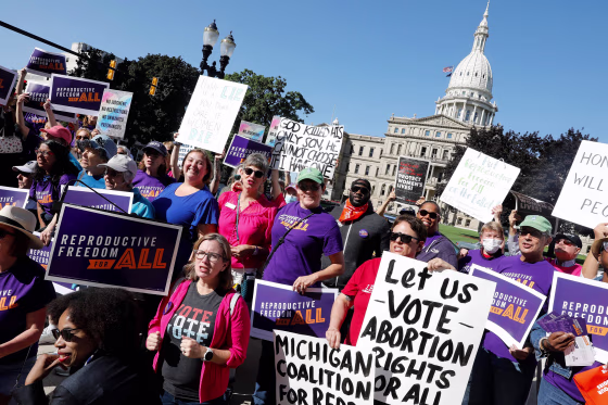 Image: Protesters gather outside the Michigan State Capitol during a "Restore Roe" rally in Lansing, Mich., on Sept. 7, 2022.