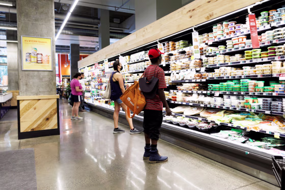 Customers shop at a supermarket