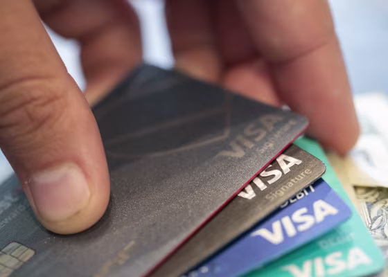 A stack of Visa credit cards.