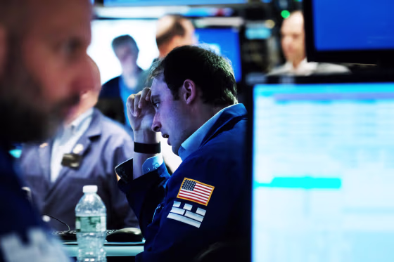 Traders work on the floor of the New York Stock Exchange