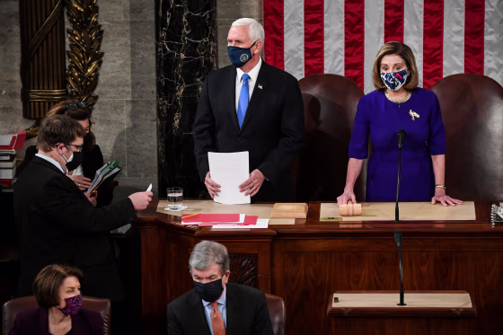 Vice President Mike Pence and House Speaker Nancy Pelosi, D-Calif., preside over a joint session of Congress to count the Electoral College votes of the 2020 presidential election in the House Chamber on Jan. 6, 2021.