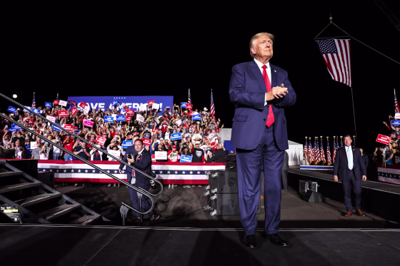 Former President Donald Trump greets supporters during a campaign rally at Minden-Tahoe Airport on Oct. 8, 2022 in Minden, Nev.