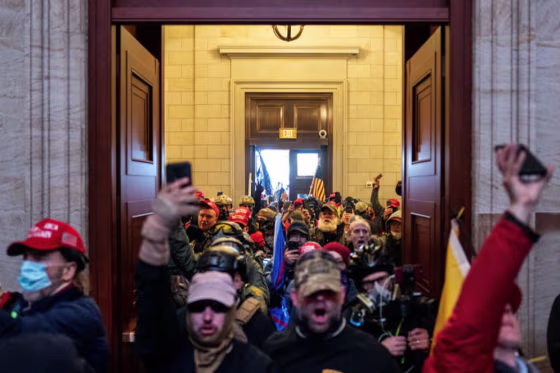 Jason Dolan, second left, at the Capitol on Jan. 6, 2021.