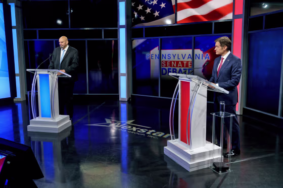 Democratic candidate Lt. Gov. John Fetterman, left, and Republican Pennsylvania Senate candidate Mehmet prior to their debate in Harrisburg on Oct. 25, 2022.