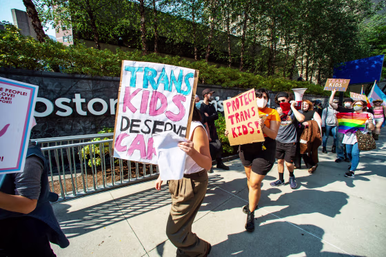 Demonstrators rally at the Boston Children's Hospital to support trans children and gender affirmation treatments.