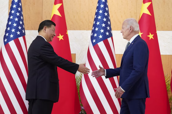 President Joe Biden shakes hands with Chinese President Xi Jinping